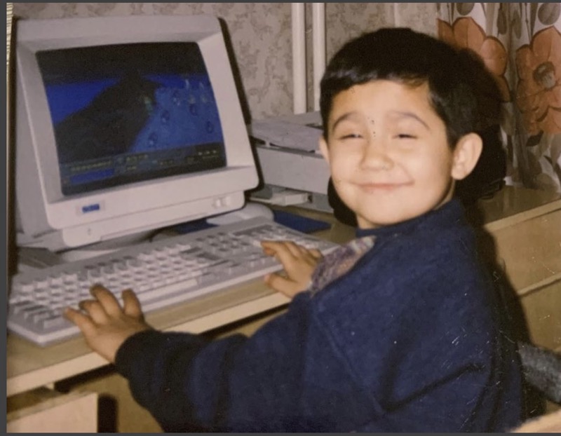 Me as a young boy, grinning at a PC mid-game